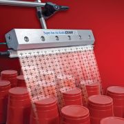 The Super Ion Air Knife eliminates static cling of plastic die cut cups.